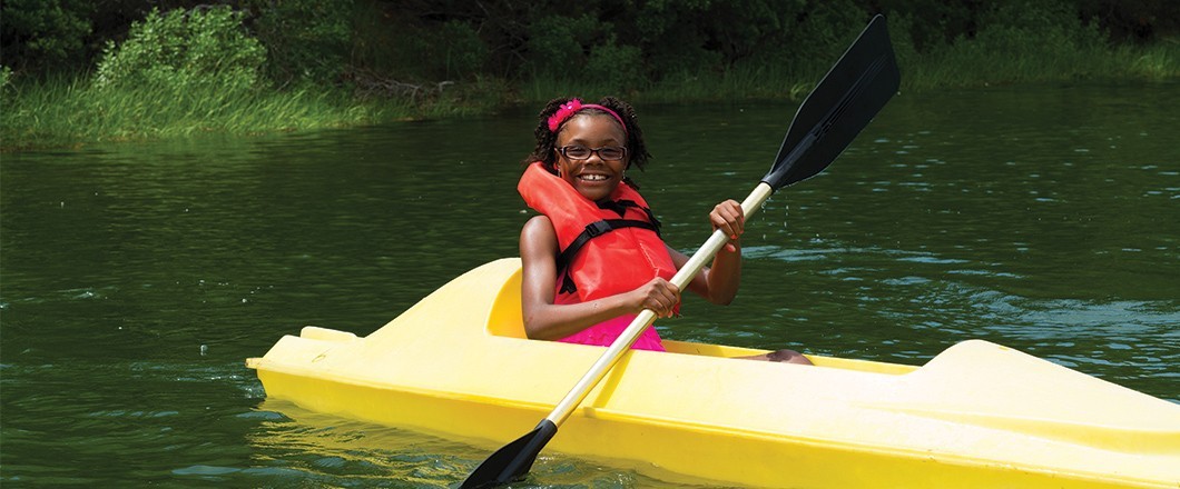 A Girl Scout has fun exploring nature