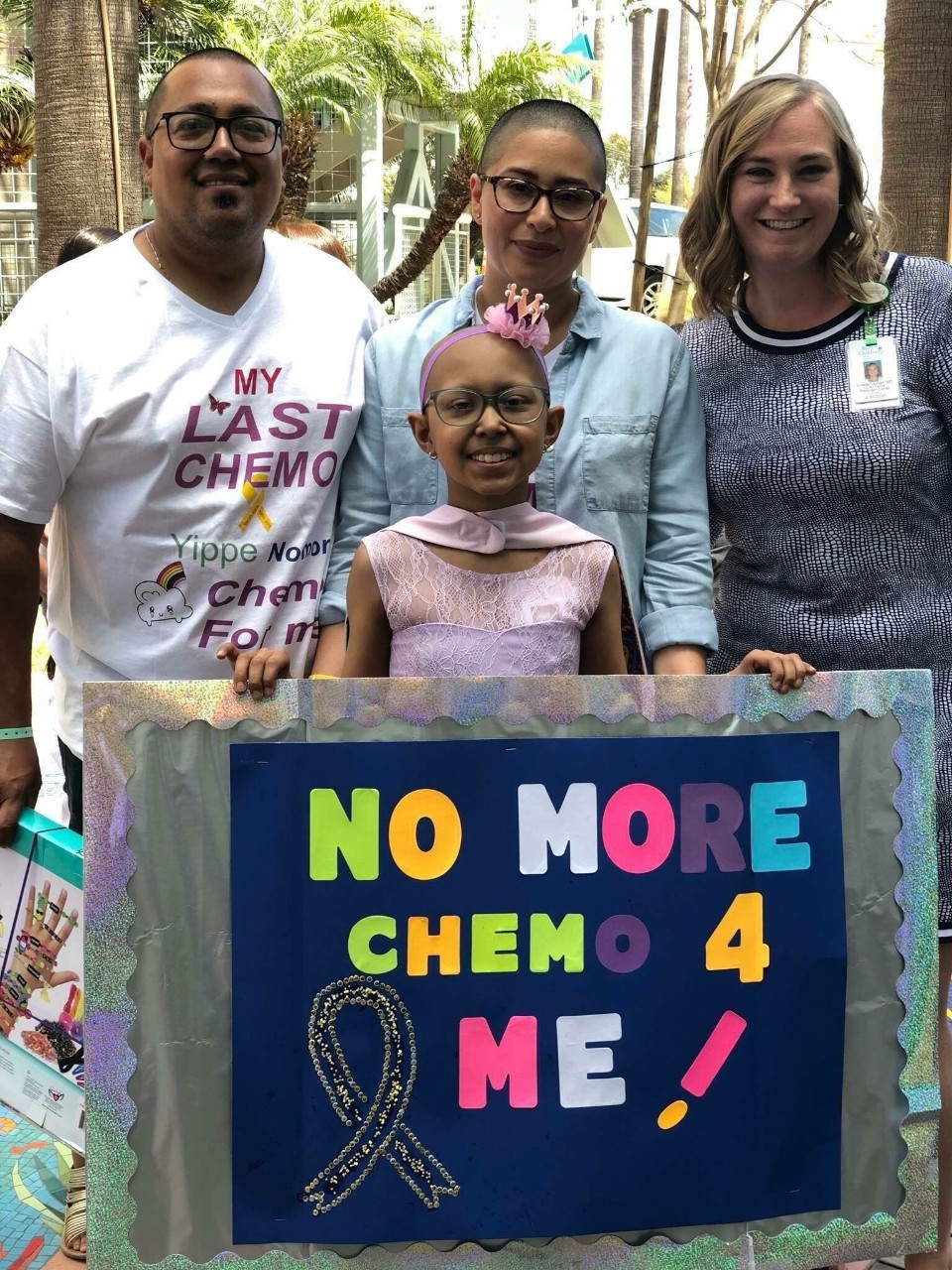 Sarah proudly displays "no more chemo for me" sign