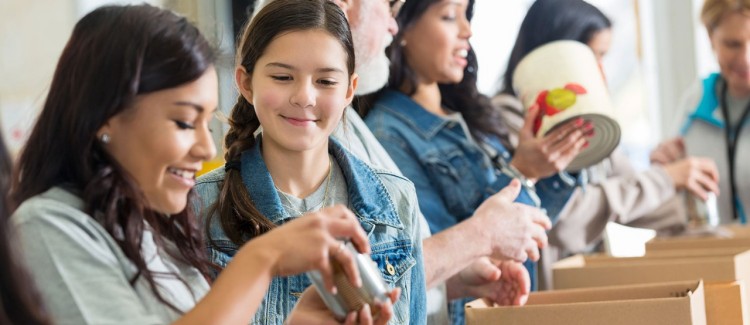 Girl participate in food drive.