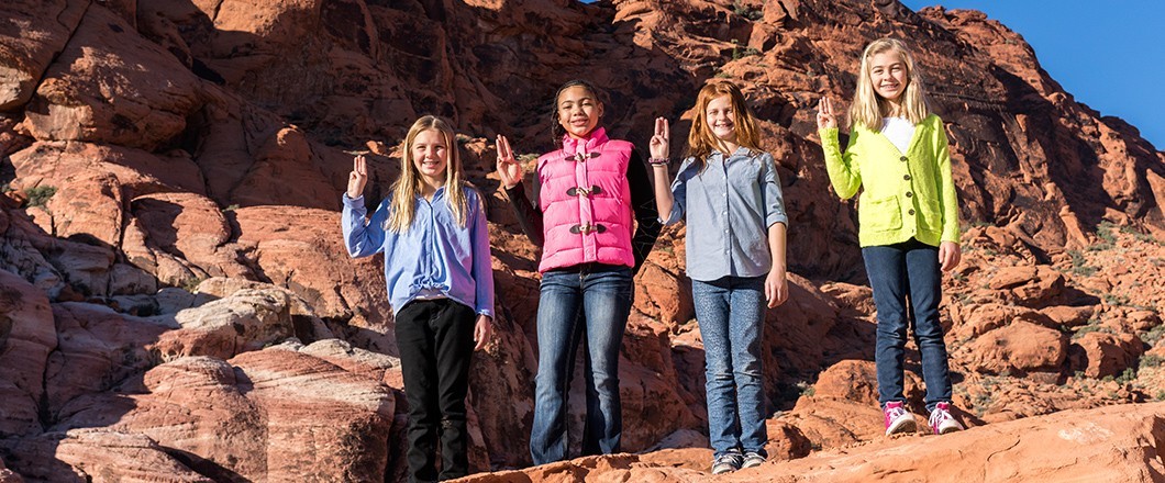 A group of Girl Scouts embrace tradition