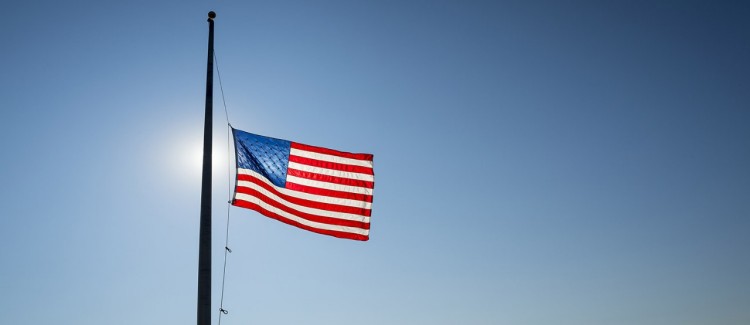 school shooting sign of school children crossing with american flag