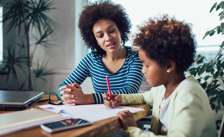 mother and daughter practice distance learning at home during coronavirus pandemic school closures