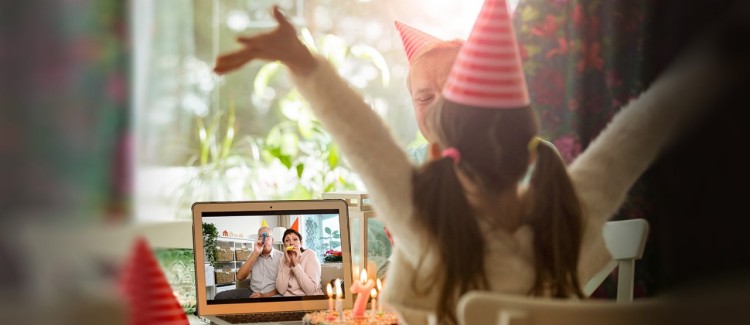 girl celebrating birthday party over zoom during coronavirus pandemic