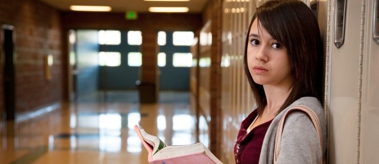 Sad girl feeling left out because she can't afford the things her friends have