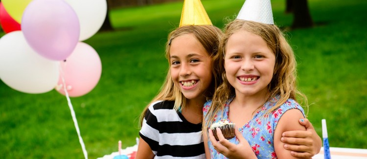 two girls having fun at a child's birthday party