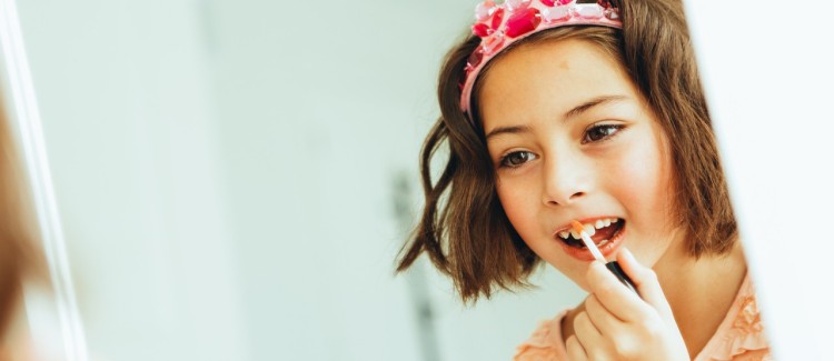 Girl looking in mirror wants to be a princess for Halloween