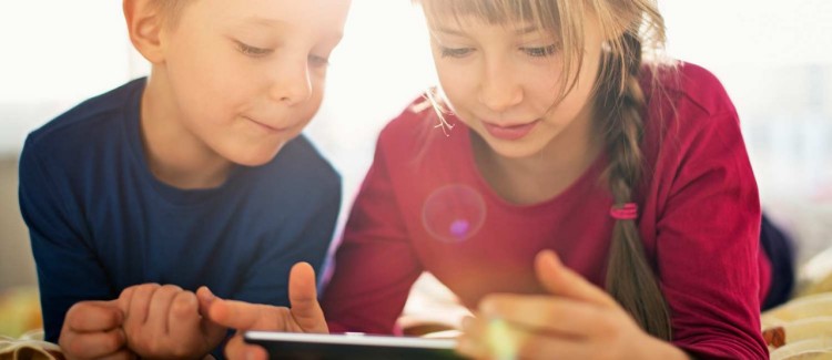 a girl and boy reading