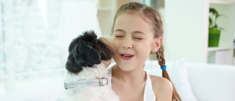 Young girl with cute dog, her first pet.