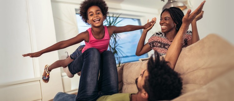 girl and her parents having fun during their summer at home