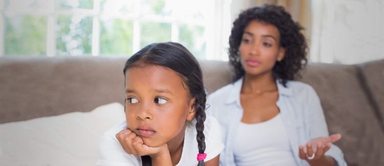 girl looking upset after stressed mom yelled at her during the coronavirus pandemic