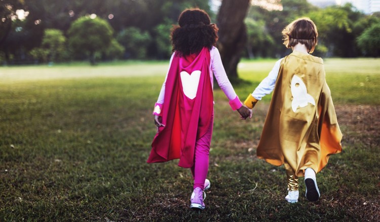 two kids showing kindness through play