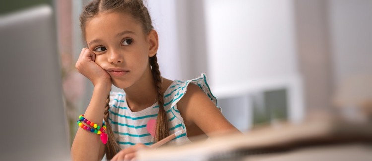 girl looking bored feeling jealous over other kids' in-person playdates during the pandemic