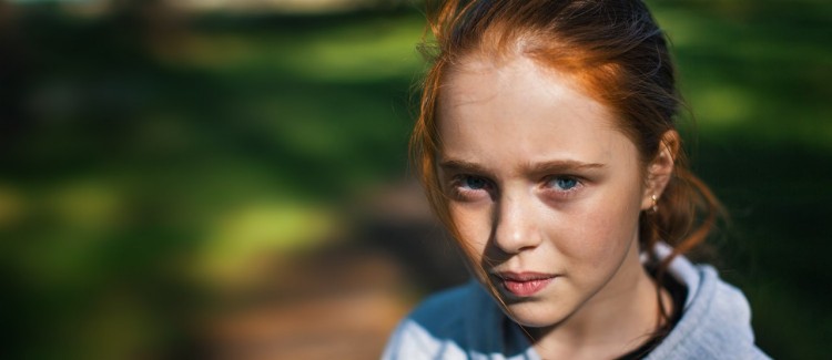 red haired girl unsure if she should apologize and say sorry