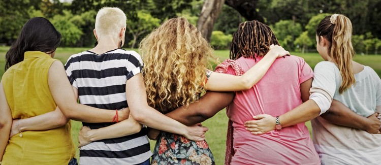 Women with different body types linking arms standing up against body shaming