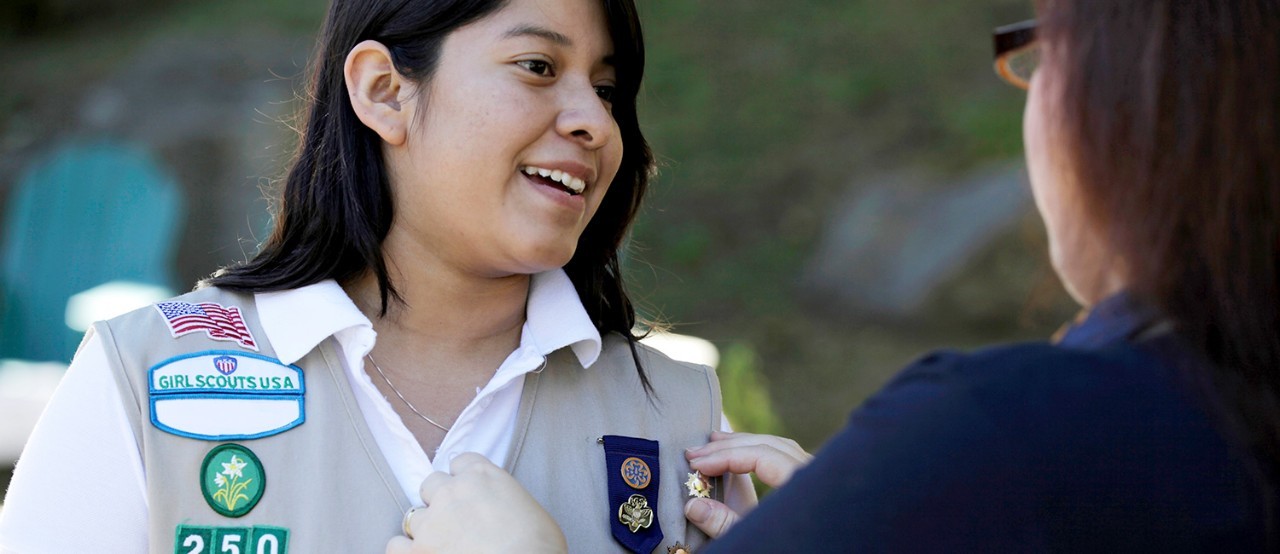 A Girl Scout receives her Gold Award